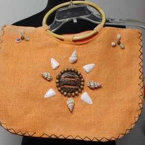 Orange jute tote bag with beach shells